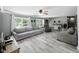 Spacious living room featuring neutral color palette, hardwood floors, and ample natural light at 1039 Eastlawn Dr, Whiteland, IN 46184