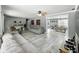 Large living room flowing into dining area, with stylish decor and hardwood flooring at 1039 Eastlawn Dr, Whiteland, IN 46184