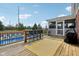 Back deck, pool, and outdoor bar stool seating create an ideal outdoor living space at 10716 Patoka Rd, Indianapolis, IN 46239