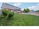 Spacious backyard featuring a lovely swimming pool with ample seating, a screened patio, and lush green grass at 10716 Patoka Rd, Indianapolis, IN 46239