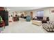 Spacious finished basement with seating area, kitchenette, and lots of room for recreation and relaxation at 10716 Patoka Rd, Indianapolis, IN 46239