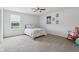 Bright bedroom featuring a comfortable bed, a window with a serene view, and charming decor for a cozy ambiance at 10716 Patoka Rd, Indianapolis, IN 46239