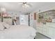 Charming bedroom boasts an elegant chandelier, shelving, and a comfortable bed for a relaxing retreat at 10716 Patoka Rd, Indianapolis, IN 46239