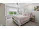Inviting bedroom with a large window offering natural light, complemented by a plush bed and stylish decor at 10716 Patoka Rd, Indianapolis, IN 46239