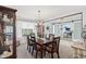 Elegant dining room featuring a wooden table and chairs, with a view into a home office at 10716 Patoka Rd, Indianapolis, IN 46239