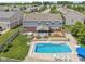 A lovely exterior view of the home with a pool, hot tub, deck, and fenced yard at 10716 Patoka Rd, Indianapolis, IN 46239