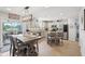 Modern kitchen with stainless steel appliances, granite countertops, central island, and adjacent dining area at 10716 Patoka Rd, Indianapolis, IN 46239