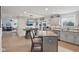 Bright kitchen featuring a stainless steel sink, stainless steel appliances, island and wood plank wall at 10716 Patoka Rd, Indianapolis, IN 46239