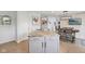Kitchen island features a granite countertop with gray cabinetry and stainless steel hardware at 10716 Patoka Rd, Indianapolis, IN 46239