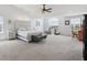 Spacious main bedroom with vaulted ceiling, a cozy sitting area, and plenty of natural light for relaxation at 10716 Patoka Rd, Indianapolis, IN 46239