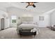 Large main bedroom featuring neutral tones, a comfortable bed, and ample natural light for a serene atmosphere at 10716 Patoka Rd, Indianapolis, IN 46239