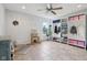 Room features a large locker room sign, a ceiling fan, window and custom organizers at 10716 Patoka Rd, Indianapolis, IN 46239