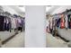Walk-in closet with double hanging racks and shelves for clothing, offering organized storage space at 10716 Patoka Rd, Indianapolis, IN 46239