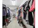 Walk-in closet featuring ample storage with clothing racks and shelves, providing organization for various apparel at 10716 Patoka Rd, Indianapolis, IN 46239