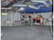 Unfinished basement includes open space for utilities and storage shelves at 115 Northshore Blvd, Anderson, IN 46011