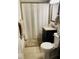 Cozy bathroom featuring a vanity with granite countertop and shower with curtain at 115 Northshore Blvd, Anderson, IN 46011