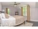 Tranquil bedroom with sloped ceiling, black floor, large windows, and natural light at 115 Northshore Blvd, Anderson, IN 46011