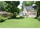 Inviting two-story home with a large lawn and mature trees at 115 Northshore Blvd, Anderson, IN 46011