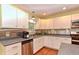 Well-lit kitchen with stainless appliances, light cabinets, and plenty of storage space at 115 Northshore Blvd, Anderson, IN 46011