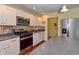 This kitchen includes stainless steel appliances, a gas range, and ample counter space at 115 Northshore Blvd, Anderson, IN 46011