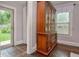 Living room featuring hardwood floors, china cabinet, and natural lighting at 115 Northshore Blvd, Anderson, IN 46011