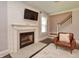 Cozy living room features a fireplace and stairs leading to the upper level of the home at 115 Northshore Blvd, Anderson, IN 46011