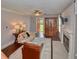 Open living room with fireplace, hardwood floors, ceiling fan, and natural light at 115 Northshore Blvd, Anderson, IN 46011