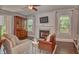 Spacious living room complete with fireplace, hardwood floors, and natural light at 115 Northshore Blvd, Anderson, IN 46011