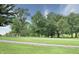 Community putting green with mature trees and landscaped grounds at 115 Northshore Blvd, Anderson, IN 46011
