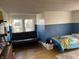 Comfortable bedroom with a futon and a bed, featuring plenty of natural light at 118 S Swain St, Ingalls, IN 46048