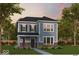 Charming two-story home with blue siding, brick accents, manicured lawn, and inviting landscape at 12222 Vera Ct, Noblesville, IN 46060