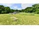 Spacious backyard featuring a horse pen and an above-ground pool surrounded by lush trees at 1284 N Letterman Rd, Paragon, IN 46166