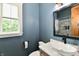 A modern bathroom vanity with a new sink and countertop, new paint, and great natural light at 1284 N Letterman Rd, Paragon, IN 46166