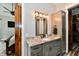 Bathroom vanity with granite countertop, gray cabinetry, and modern lighting fixtures at 1284 N Letterman Rd, Paragon, IN 46166