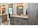 Bathroom with double sinks, granite countertop, and stylish gray cabinetry at 1284 N Letterman Rd, Paragon, IN 46166
