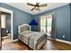 A newly painted bedroom with hardwood floors, a ceiling fan, and great natural light at 1284 N Letterman Rd, Paragon, IN 46166