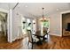 A dining room with wood floors, large windows, and elegant decor at 1284 N Letterman Rd, Paragon, IN 46166