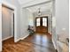Welcoming entryway with wood-look floors, decorative lighting, and double front doors at 1284 N Letterman Rd, Paragon, IN 46166