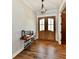 Welcoming entryway with wood-look floors, decorative lighting, and double front doors at 1284 N Letterman Rd, Paragon, IN 46166