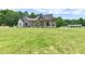 Charming two-story home with a covered porch, spacious yard, and beautiful stone and brick accents at 1284 N Letterman Rd, Paragon, IN 46166