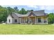 Charming two-story home with a covered porch and beautiful stone and brick accents at 1284 N Letterman Rd, Paragon, IN 46166