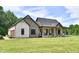 Charming two-story home with a covered porch and beautiful stone and brick accents at 1284 N Letterman Rd, Paragon, IN 46166