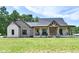 Charming two-story home with a covered porch and beautiful stone and brick accents at 1284 N Letterman Rd, Paragon, IN 46166