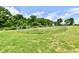 Picture of the property showing a metal fenced area in the middle of a field with trees surrounding it at 1284 N Letterman Rd, Paragon, IN 46166