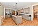 Well-equipped kitchen featuring gray cabinetry, a large island, stone countertops, and modern stainless steel appliances at 1284 N Letterman Rd, Paragon, IN 46166