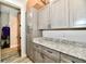 A view of the laundry room cabinets and countertop with new paint, in a home for sale at 1284 N Letterman Rd, Paragon, IN 46166
