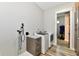A view of the laundry room with a new washer and dryer and cabinets with light countertops at 1284 N Letterman Rd, Paragon, IN 46166