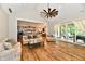 Open concept living room with hardwood floors, a modern ceiling fan, and large windows providing lots of natural light at 1284 N Letterman Rd, Paragon, IN 46166