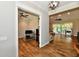 Open-concept living room with wood floors flows into the office, offering a versatile and modern living space at 1284 N Letterman Rd, Paragon, IN 46166