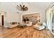Spacious living room with vaulted ceilings, hardwood floors, and a glimpse into the gourmet kitchen at 1284 N Letterman Rd, Paragon, IN 46166